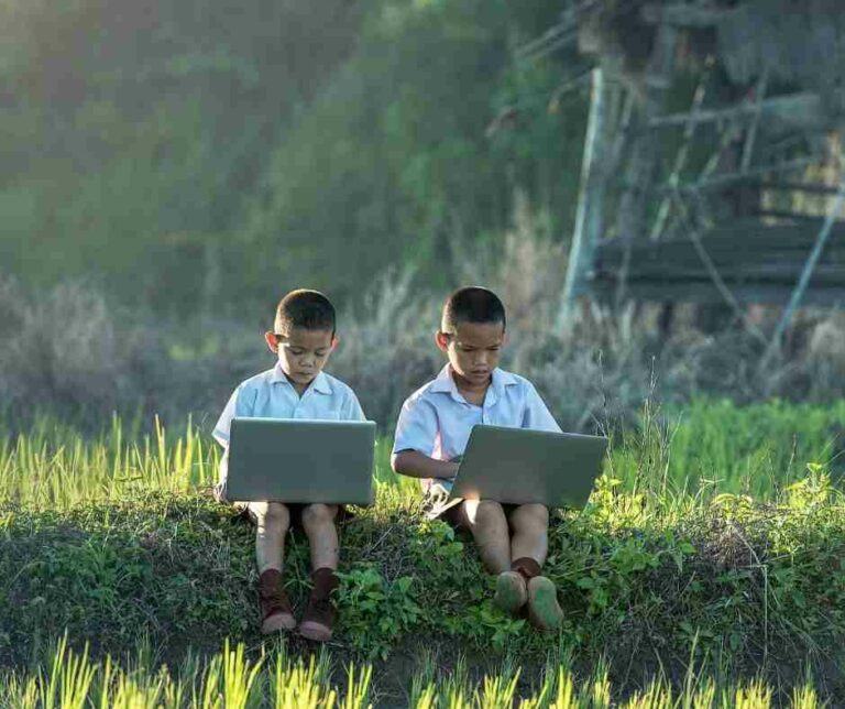two Asian boys looking at laptops porn and sexual violence