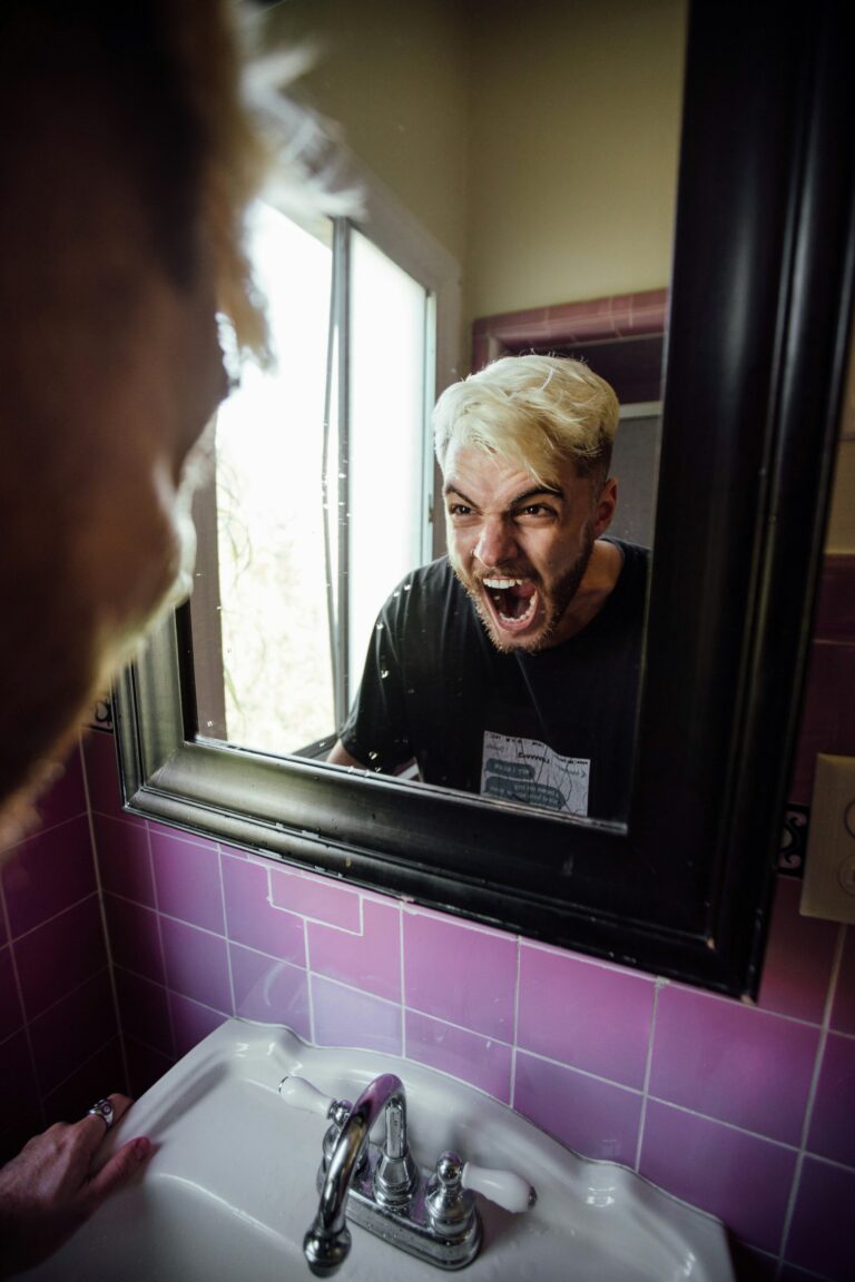 angry guy yelling at self in mirror is porn use and depression linked