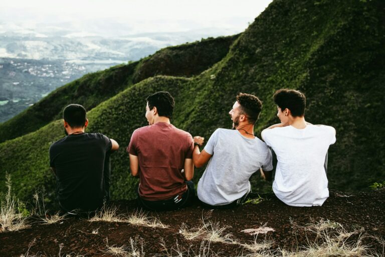 4 guys on a mountain enjoying company - is porn use and depression linked