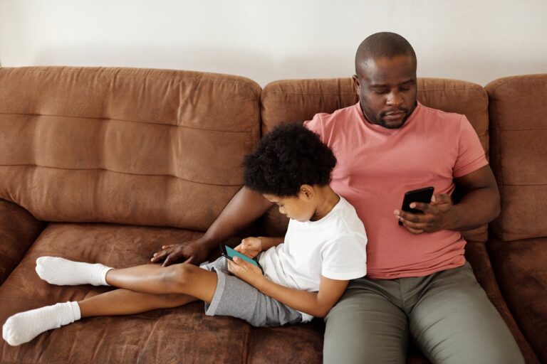 Father and son on cell phones together When your child is already viewing porn: Sexpectations - a book of hope and help