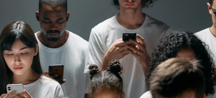 Group of young people on smartphones: Why Is Porn So Addictive?